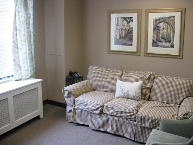 Our clean, comfortable sitting room features lots of natural light.